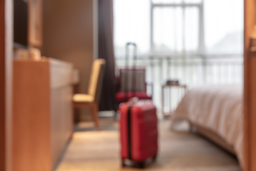 Red,Suitcase,Placed,In,Hotel,Room,,Travel,Accommodation,Concept